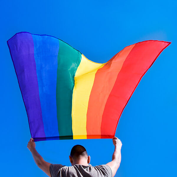 Man holding gay pride flag