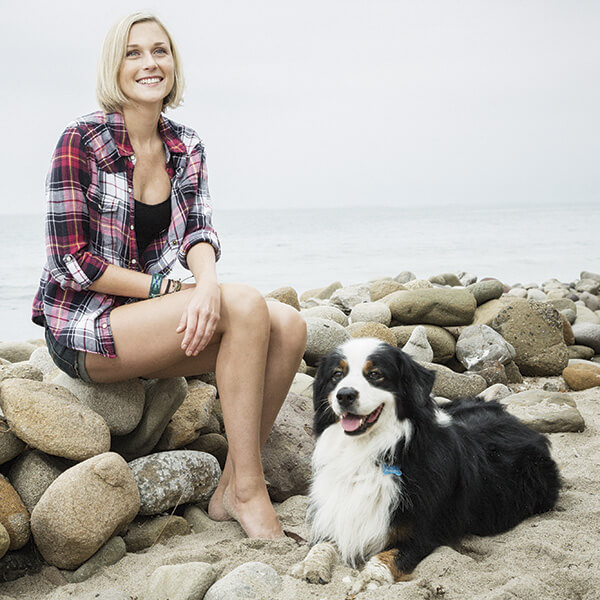 Woman on beach with dog